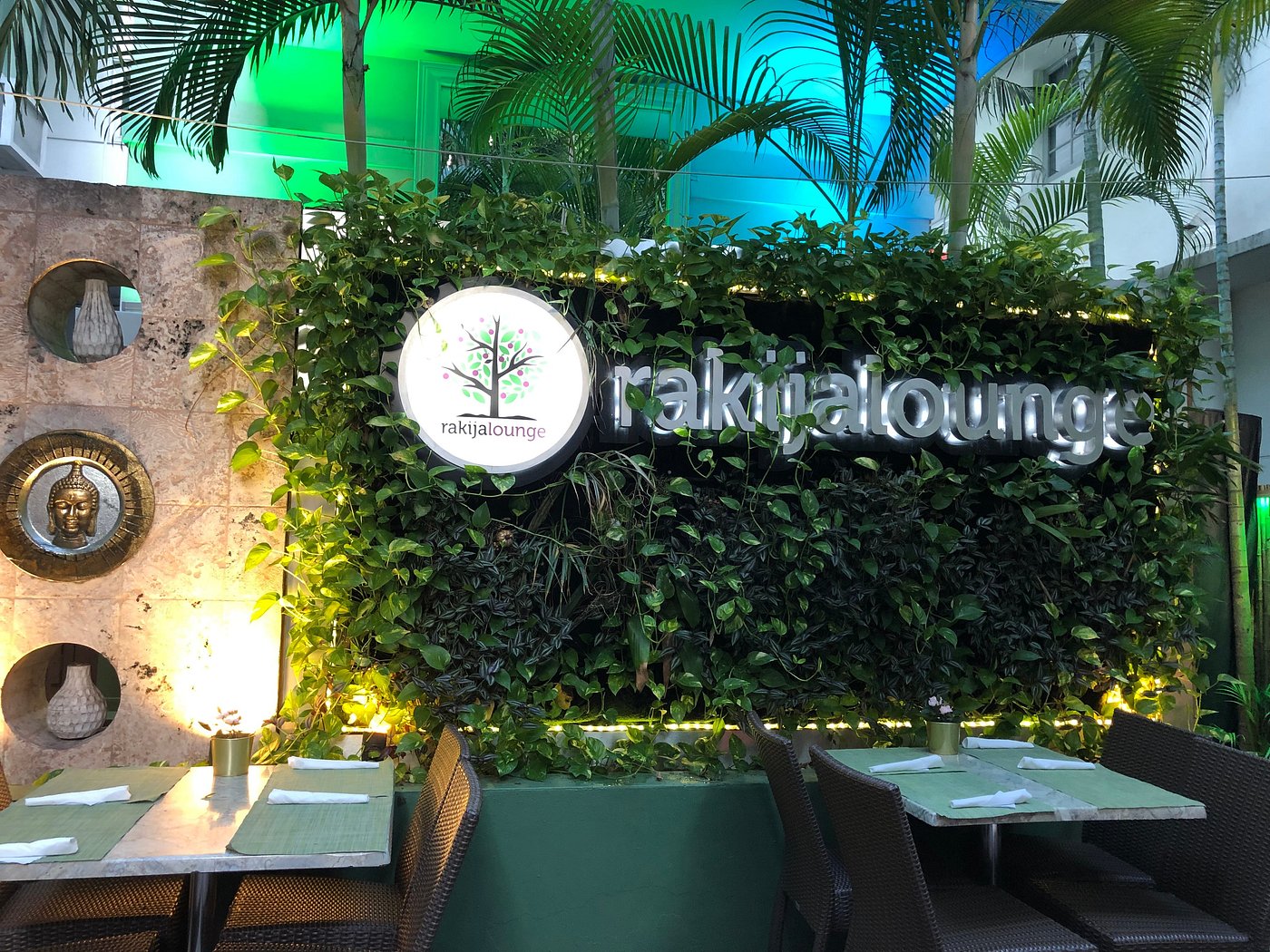 Rakija Lounge evening patio Evening patio seating in front of the Rakija Lounge sign.