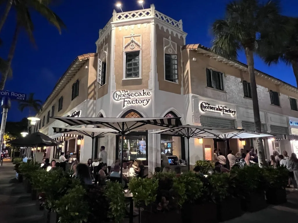Restaurant guests enjoying food and drinks near Lincoln Road in Miami Beach.