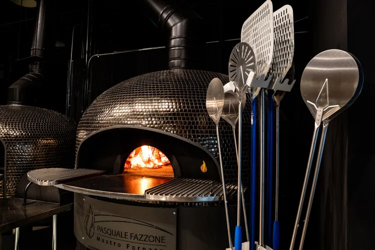 Wood-fired pizza oven used to prepare handcrafted pizzas in Francesco Martucci’s Miami location
