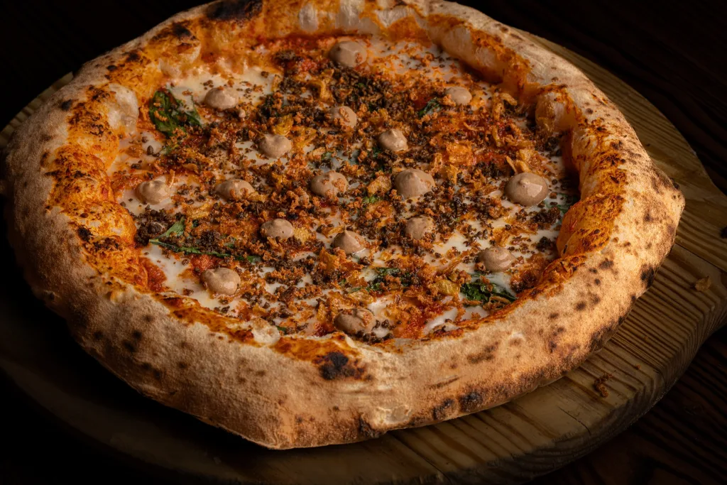 Gourmet Italian pizza topped with premium cured meats and artisan ingredients