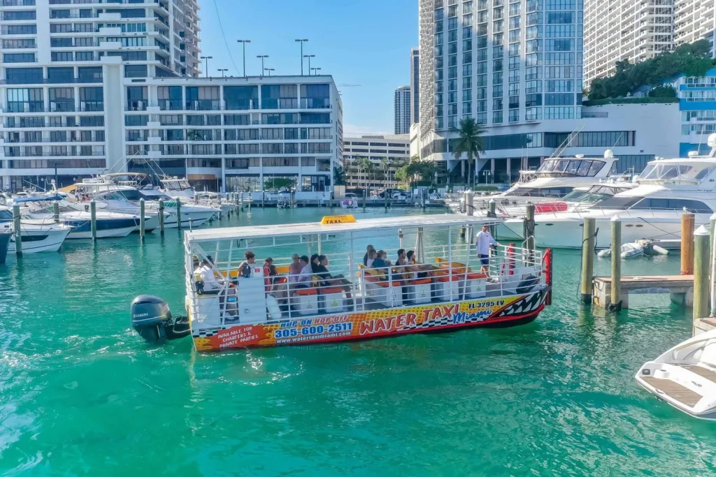 Downtown Miami skyline seen from a water taxi on a bright sunny day.