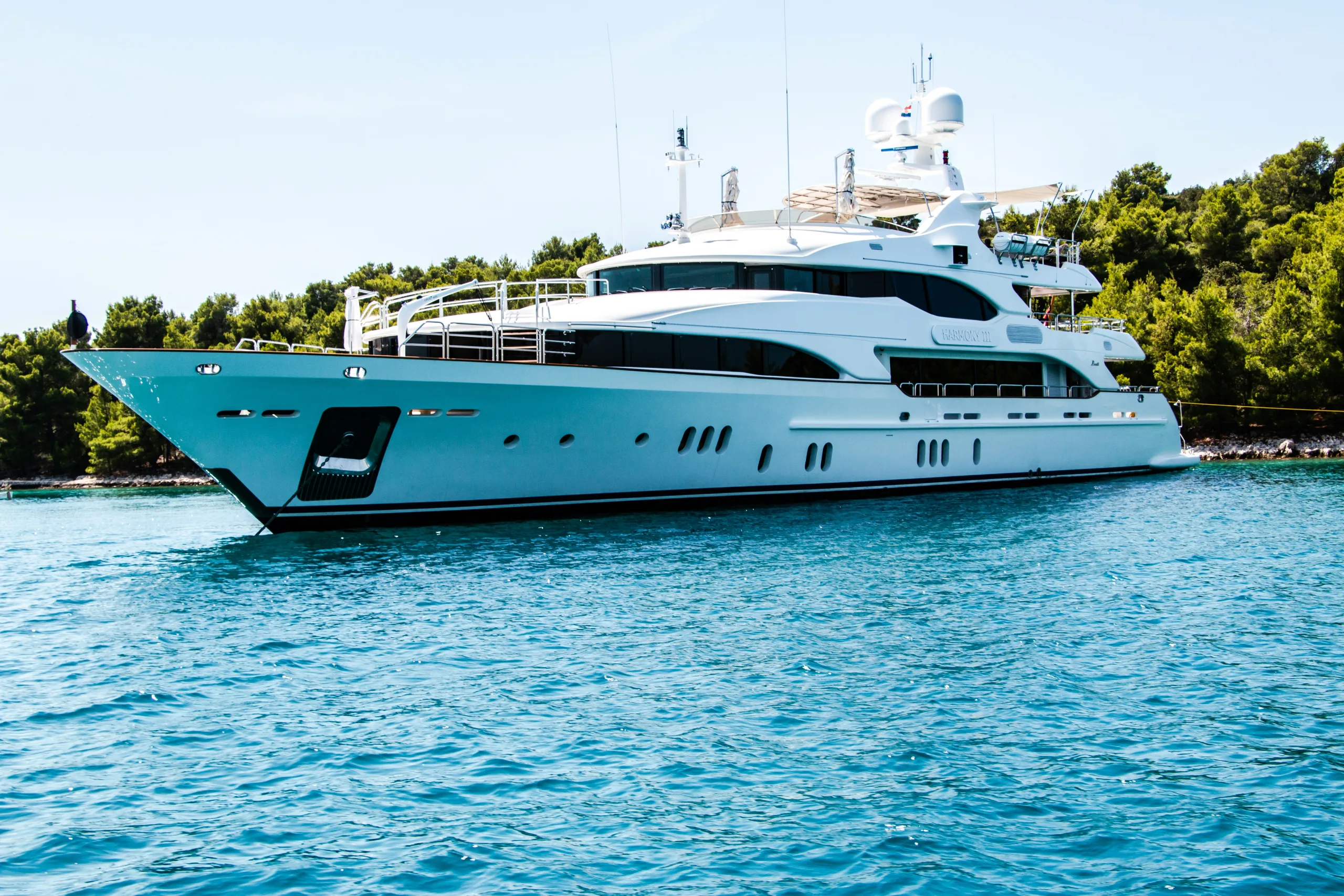 yacht Ultra-luxury superyacht at the Miami Boat Show, featuring a sleek modern profile, glossy white finish, and upscale marina backdrop