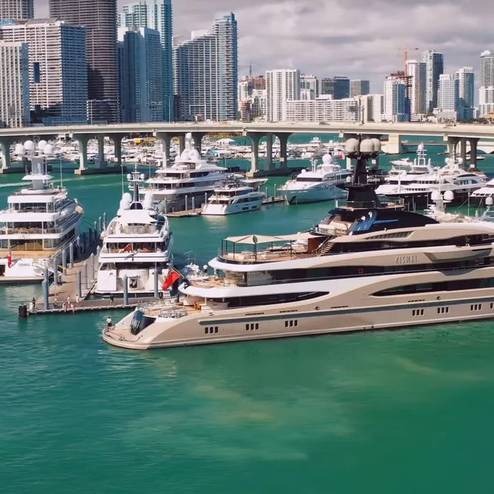 Close-up of a modern superyacht at the Miami Boat Show, showcasing polished decks and premium design details