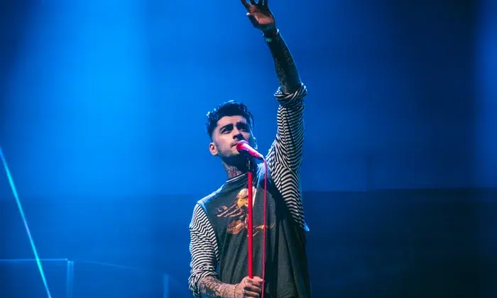 Zayn Malik performing live with concert lighting
