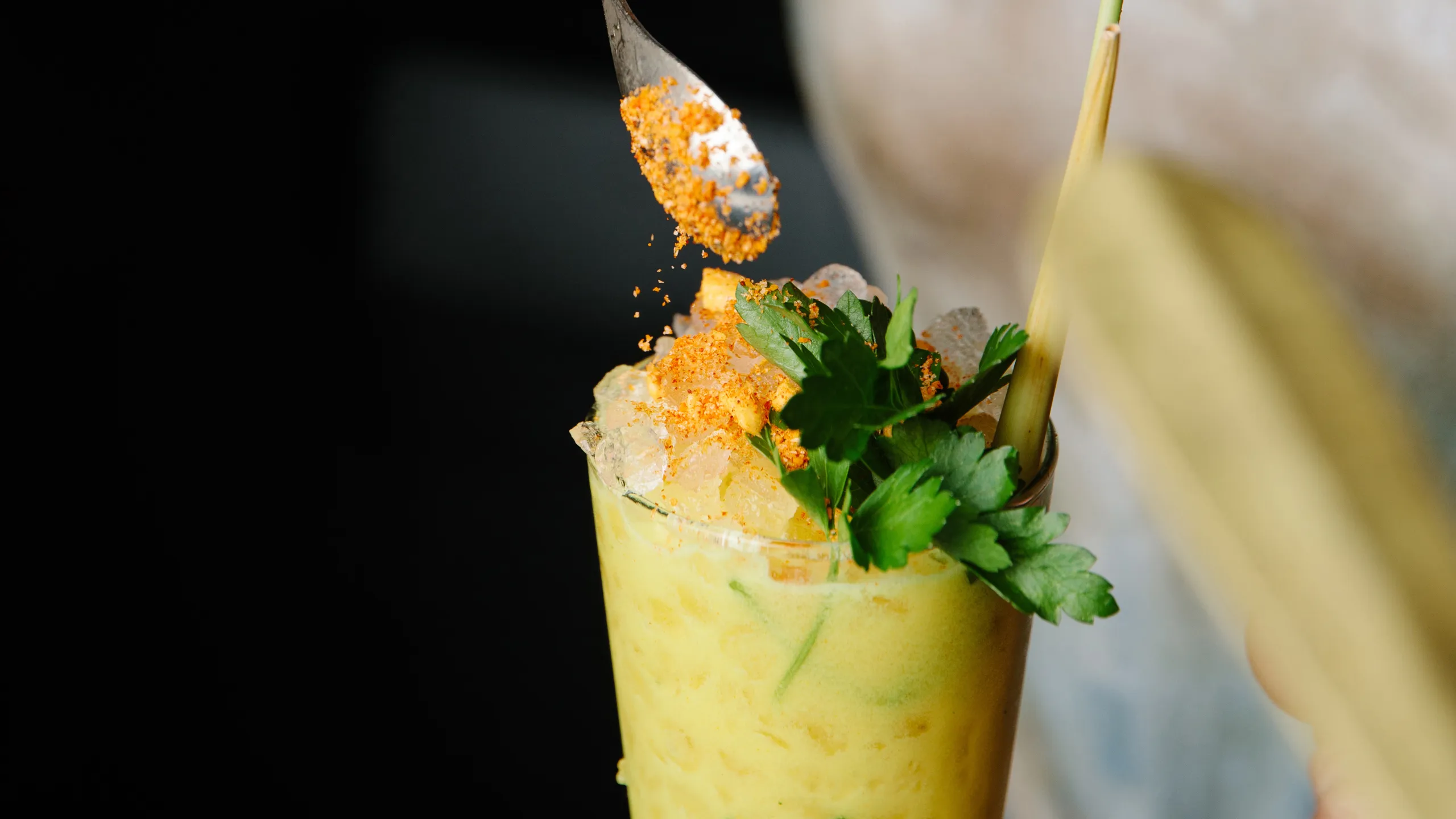 Fresh tropical cocktail with herbs and spices served during happy hour at Broken Shaker Miami Beach