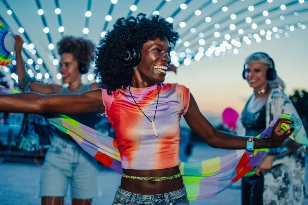 Silent Disco Train Miami party with people dancing using wireless LED headphones