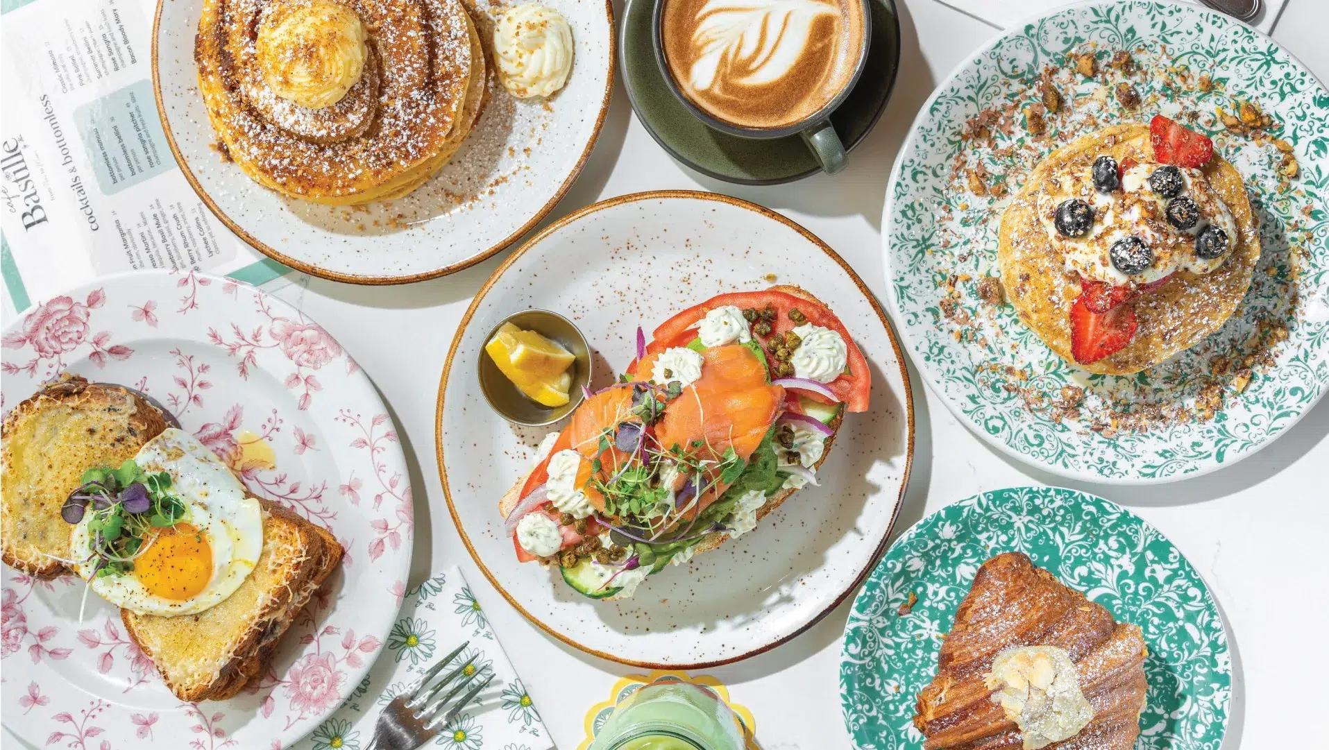 bastille-miami-beach Mixed brunch dishes at Café Bastille including pancakes, omelettes, toast, and fresh café favorites