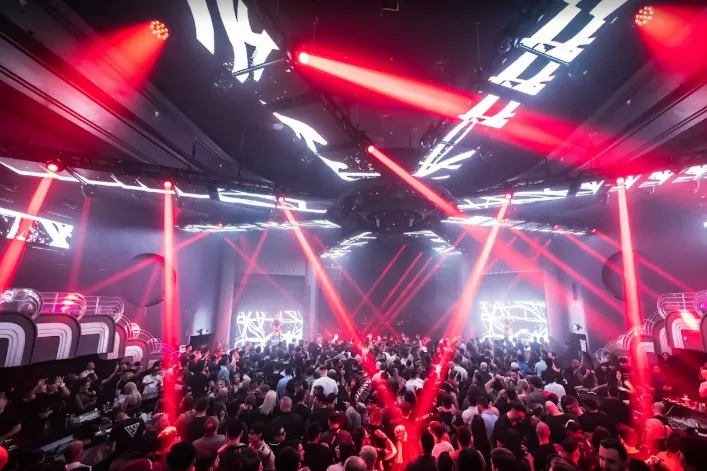 Interior of Club M2 Miami with dramatic lighting, a packed dance floor, and high energy nightlife