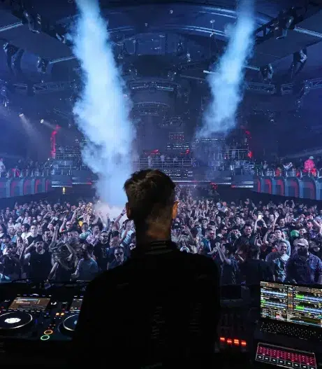 DJ performing at Club M2 Miami with impressive visuals and a vibrant party crowd