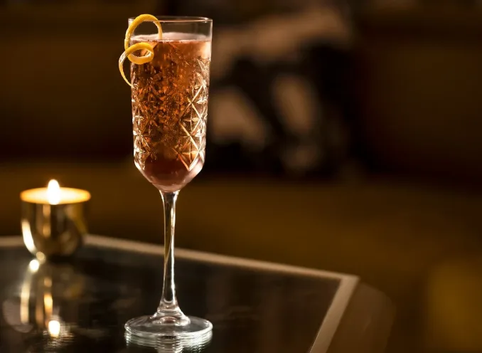 Signature cocktail served at Lapidus Bar in Miami Beach, beautifully presented in an upscale setting
