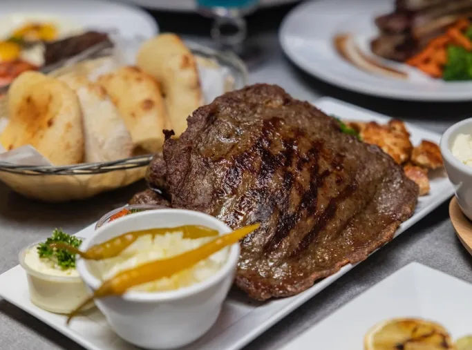Lunch table at Rakija Lounge featuring flavorful dishes in a relaxed and stylish dining setting