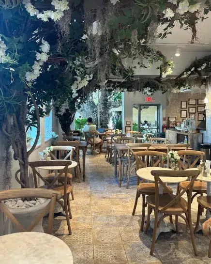 Maman bar in Miami Beach with a cozy, stylish interior, soft lighting, and a charming French-inspired atmosphere.