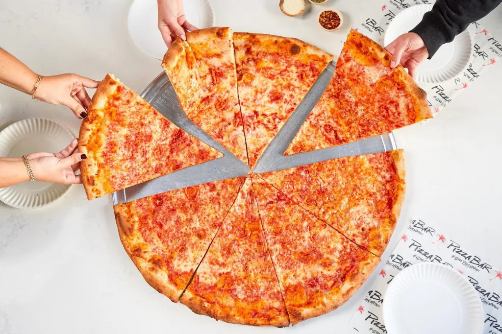 Large pizza slices served at Pizza Bar Miami Beach