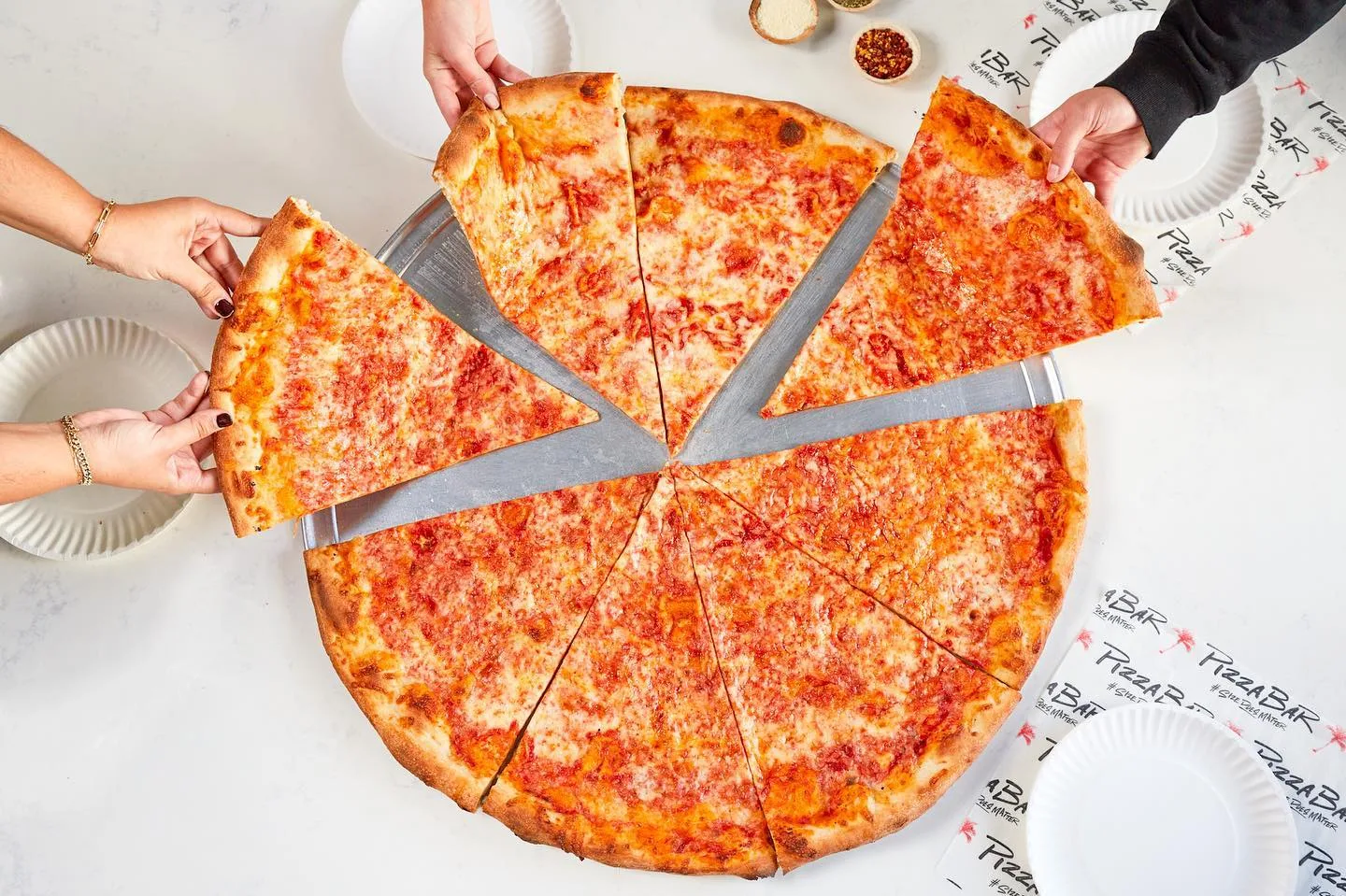 miami-beach-pizza Large pizza slices served at Pizza Bar Miami Beach