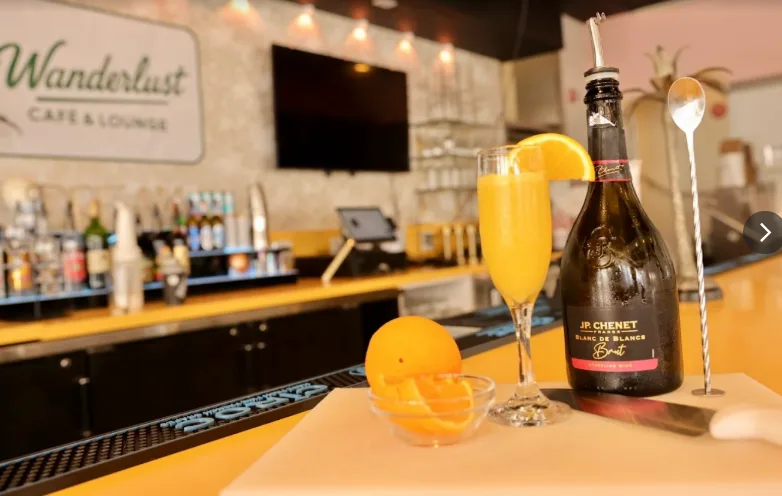 Signature drink served at Wanderlust Cafe in Miami Beach, presented in a stylish glass with a fresh, inviting look.