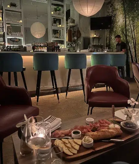Interior of Water Lion Wine bar in Miami Beach with warm lighting, elegant decor, and a cozy atmosphere for wine and conversation.