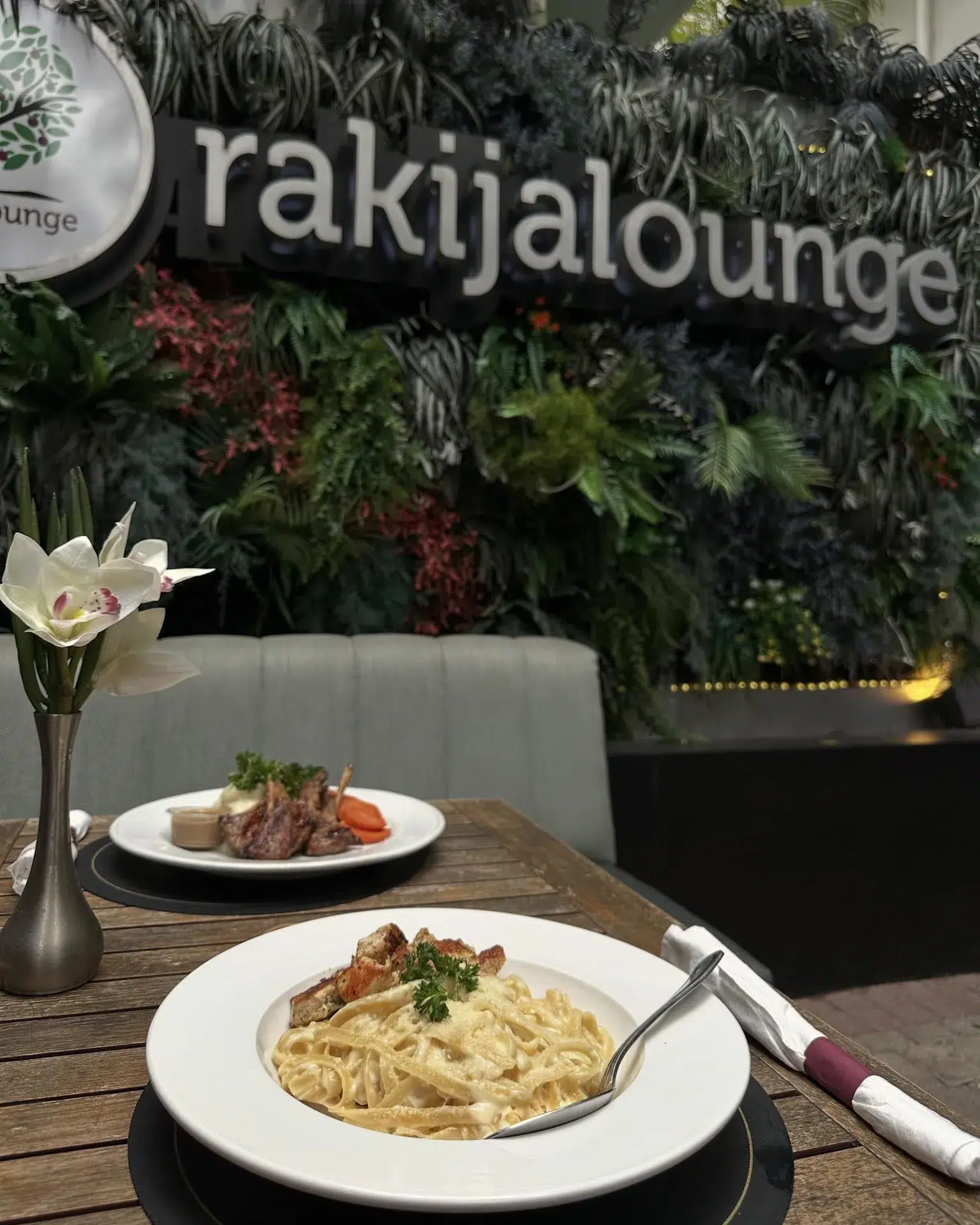 Elegant dining table with signature dishes at Rakija Lounge restaurant in Miami Beach