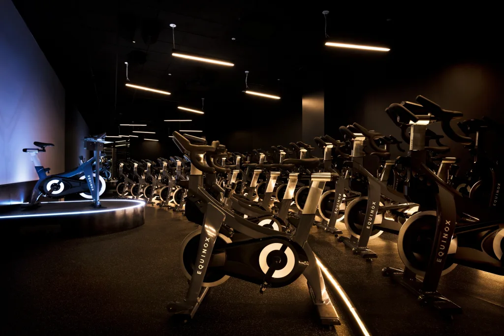 Indoor cycling studio with modern spin bikes at Equinox South Beach gym in Miami Beach