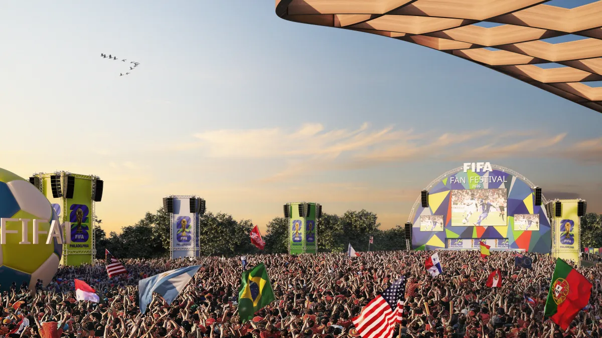 FIFA Fan Festival outdoor fan zone with thousands of soccer fans watching World Cup matches on a giant screen.