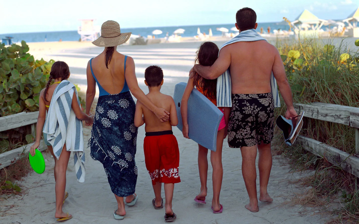 Families enjoying a spring picnic with ocean views at South Pointe Park in Miami Beach.