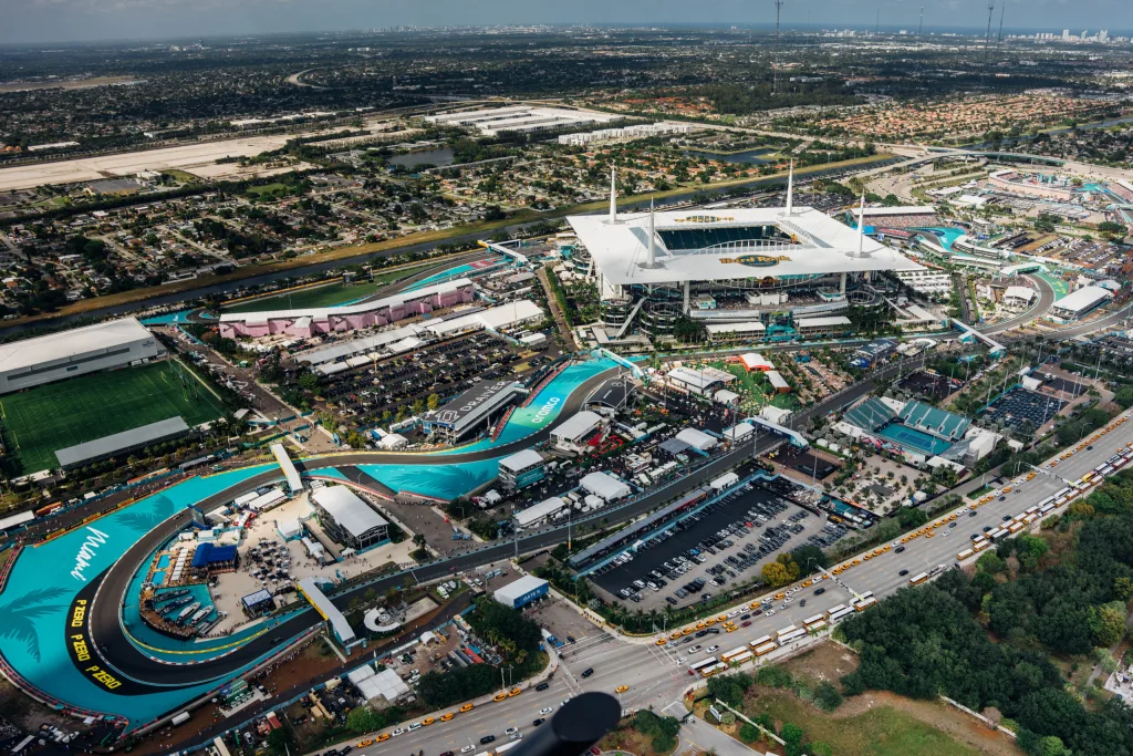 F1 Miami track with racing cars and excited audience in the grandstands
