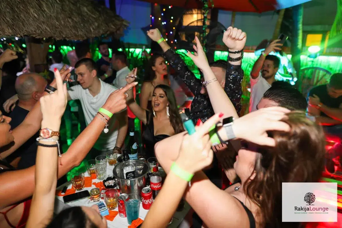 Guests enjoying vibrant nightlife and live music at Rakija Lounge Miami Beach