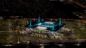 Hard Rock Stadium illuminated at night before a World Cup event