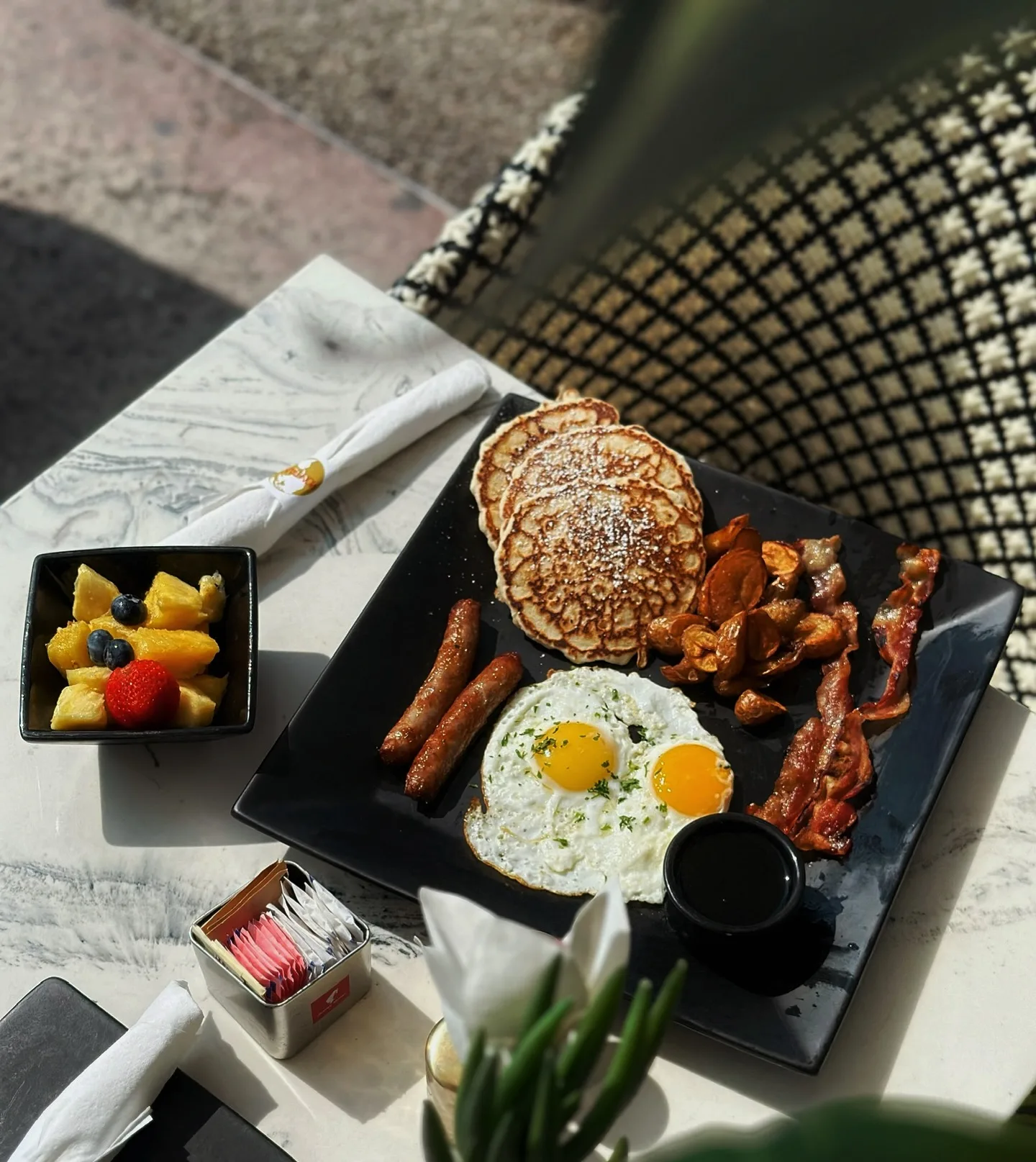 Luxury brunch breakfast with pancakes, eggs, bacon and fresh fruit at Montana's in Miami