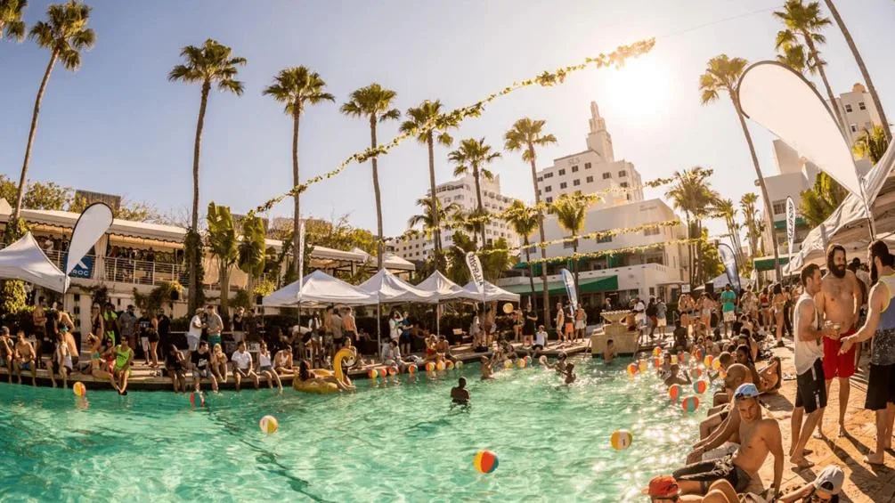Miami Beach pool party with palm trees, DJ vibes, and people enjoying a sunny day