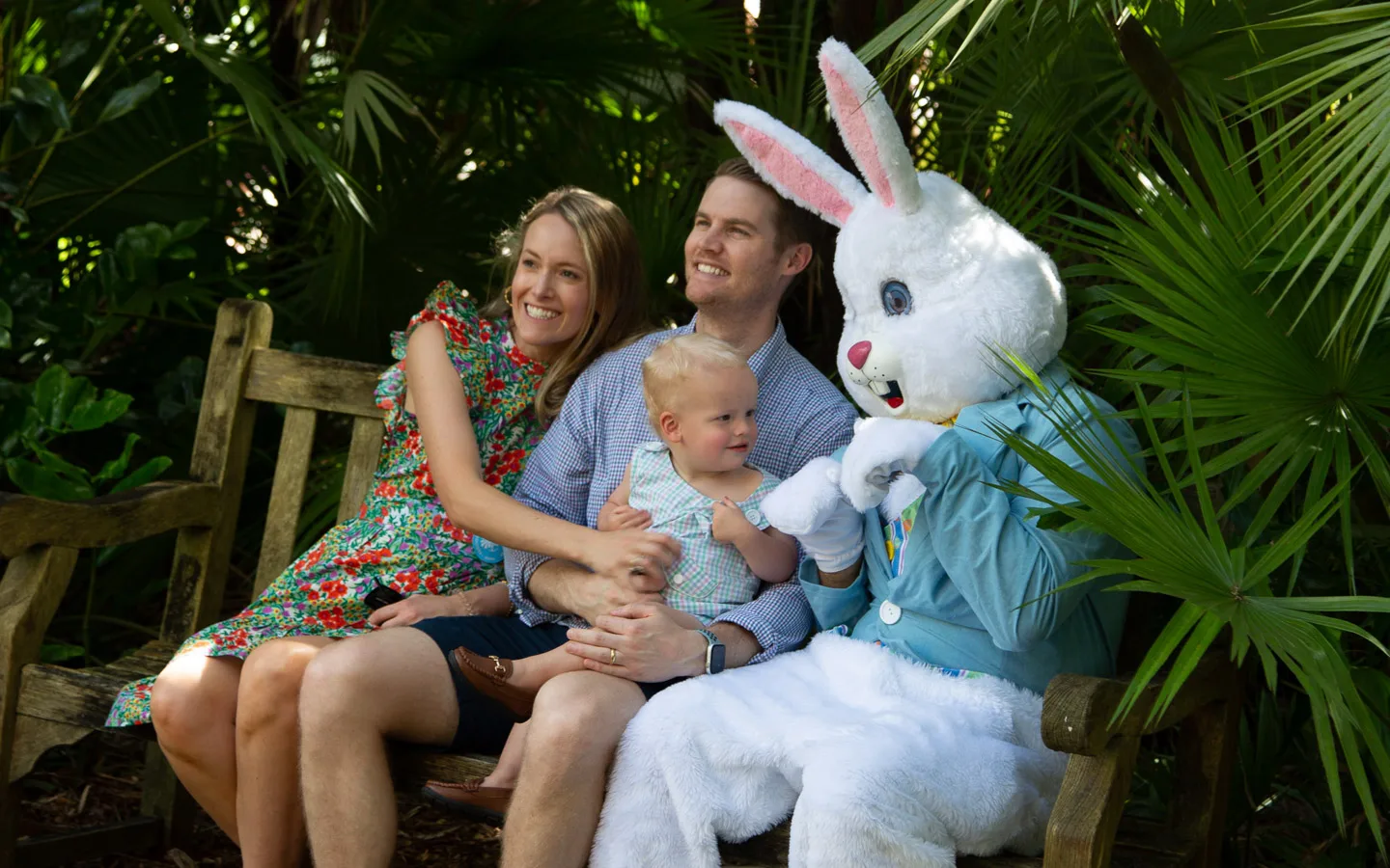 Family taking a photo with the Easter Bunny mascot during a spring Easter celebration event