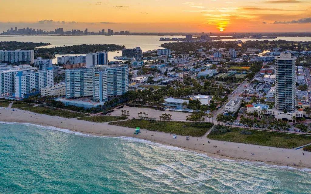 Quiet North Beach Oceanside Park shoreline in Miami Beach with palm trees and calm ocean waves