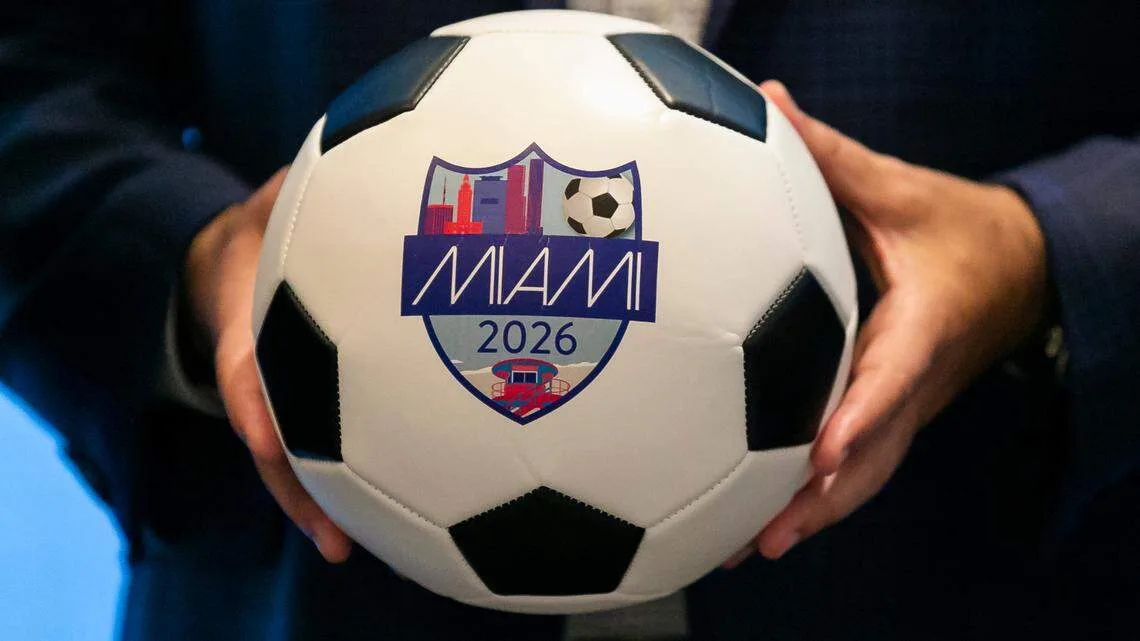 Person holding a soccer ball featuring the Miami 2026 FIFA World Cup logo, symbolizing Miami’s role as a host city for the tournament.