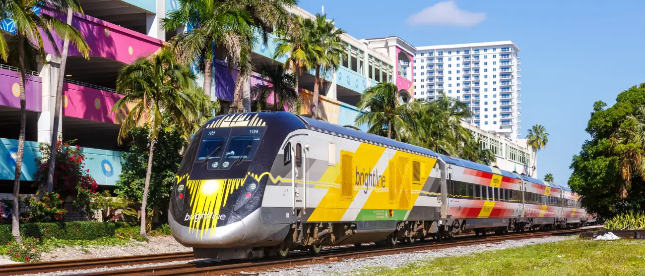 Brightline train traveling through South Florida near Miami as part of transportation options for FIFA World Cup 2026 fans.