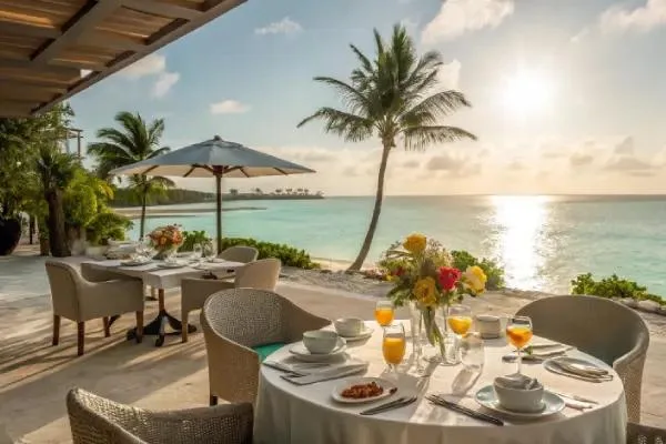 Luxury oceanfront brunch setup in Miami with tropical views, palm trees, and elegant table setting by the beach at sunrise