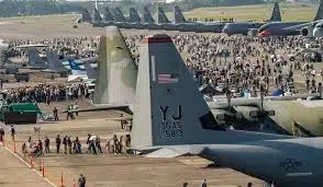 Large crowd gathered around military aircraft at an outdoor air show featuring U.S. Air Force planes during Miami Memorial Day Weekend festivities.
