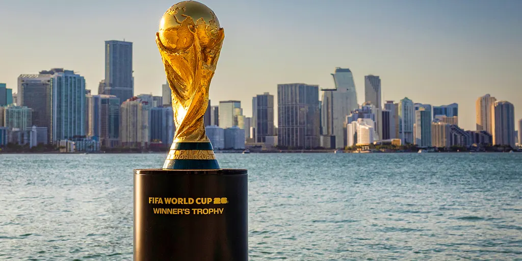 FIFA World Cup trophy displayed in front of the Miami skyline waterfront ahead of the 2026 World Cup, symbolizing Miami’s growing role as a global football and entertainment destination.