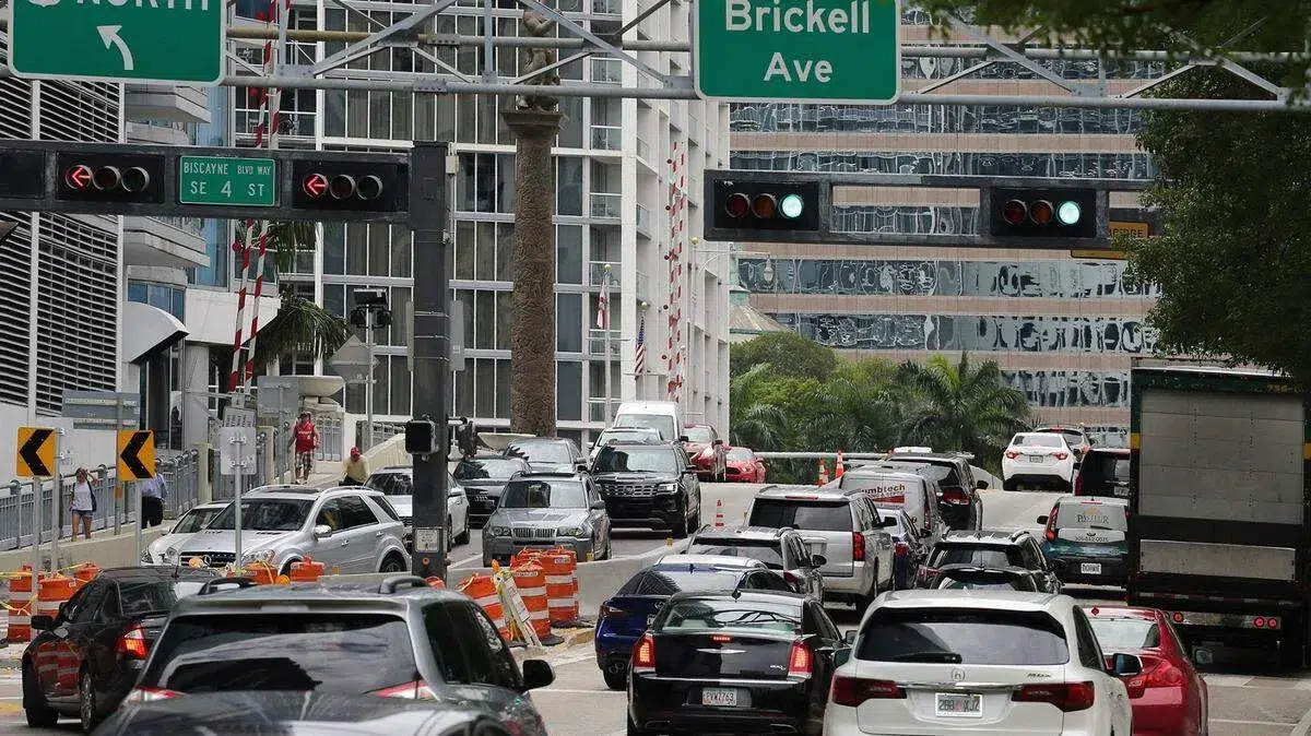 Heavy traffic congestion near the Brickell Avenue Bridge in Downtown Miami during rush hour with cars waiting as the drawbridge opens.