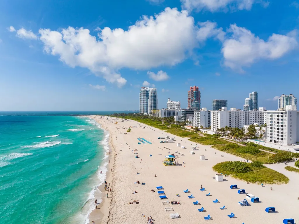 Iconic South Beach in Miami Beach with colorful lifeguard tower, bright sand, and ocean views