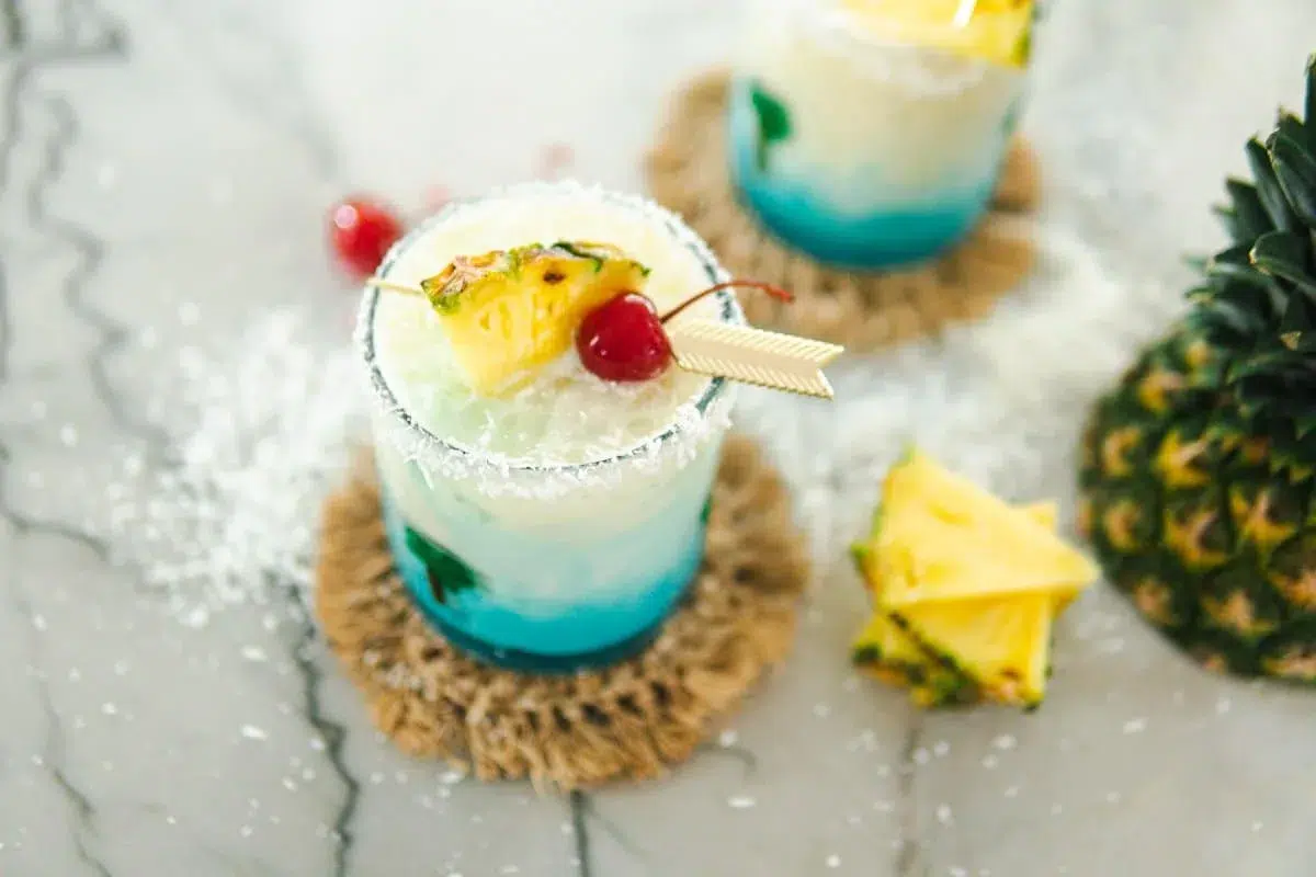 Frozen tropical cocktail with pineapple garnish served at a Miami Beach rooftop or poolside bar during Memorial Day Weekend celebrations.