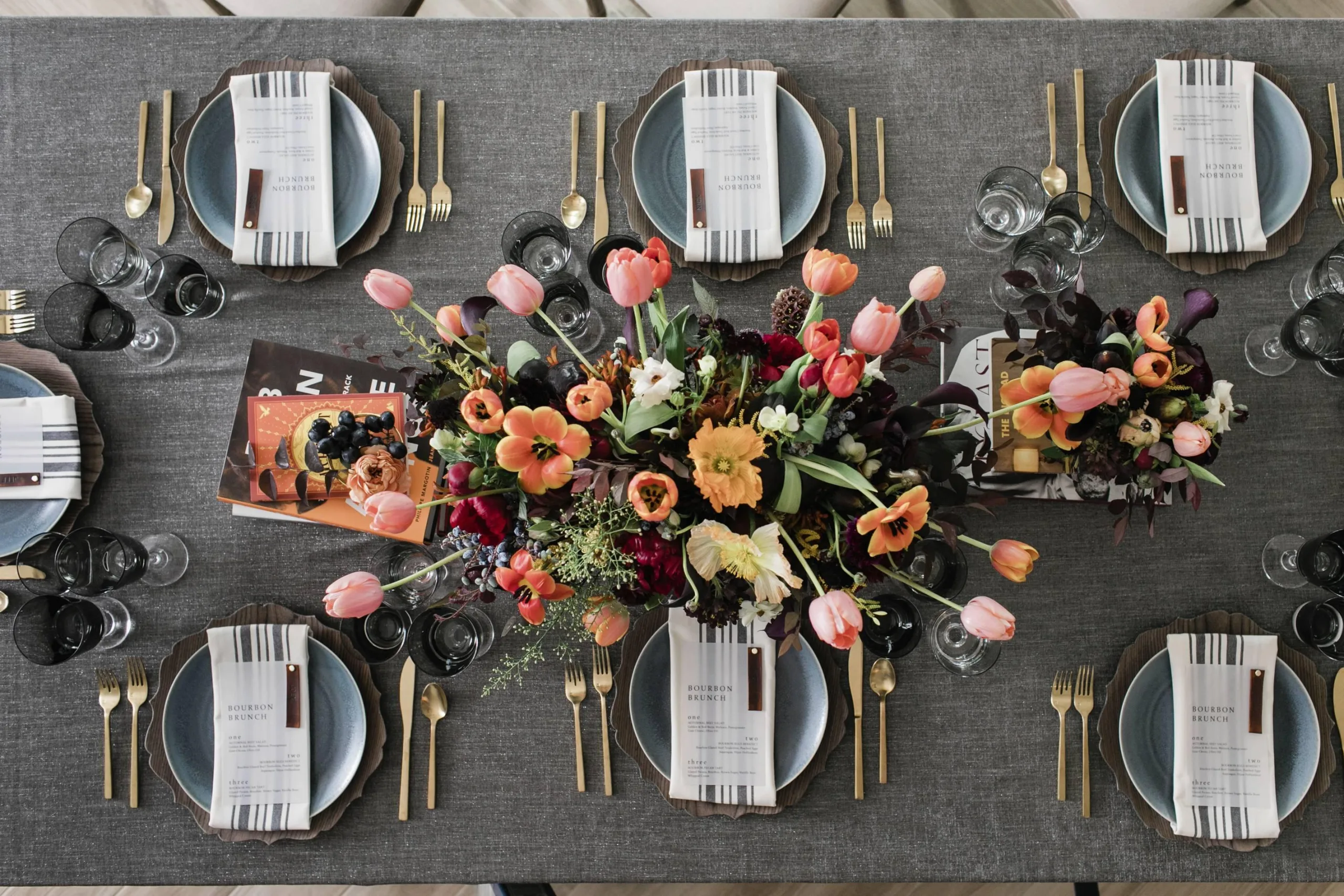 Beautifully arranged dining table with floral centerpiece, plates, and cutlery, perfect for a Mother’s Day celebration brunch