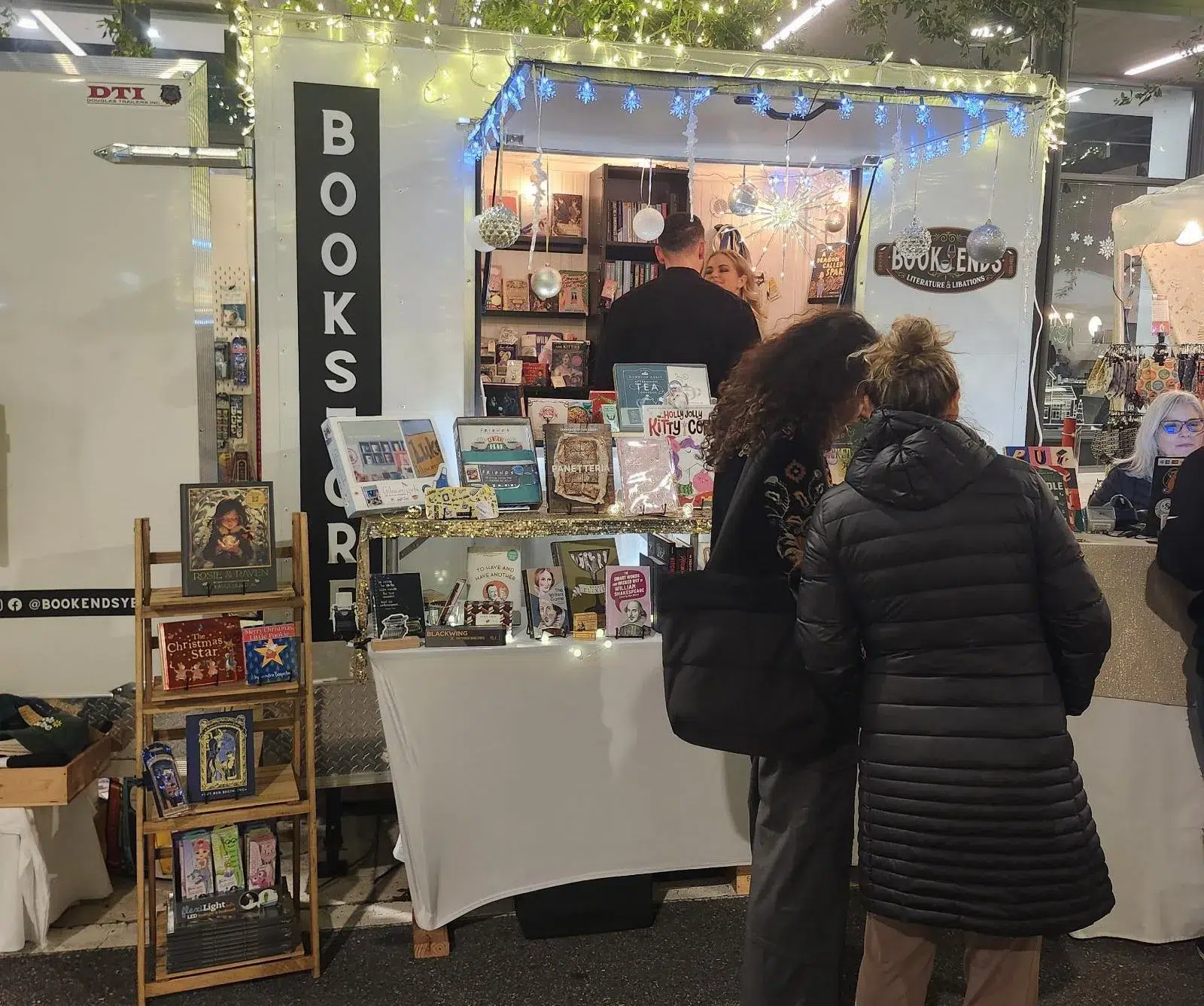Independent bookstore vendor booth at a Miami Juneteenth event featuring books, local creators, community engagement, and cultural exhibits celebrating Black history and heritage.
