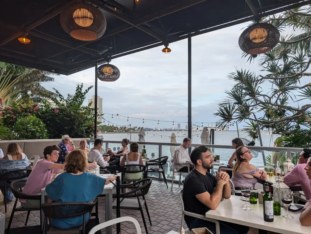 Waterfront restaurant in Miami featuring outdoor terrace seating, bay views, and a relaxed atmosphere, making it a popular Father's Day dining destination.