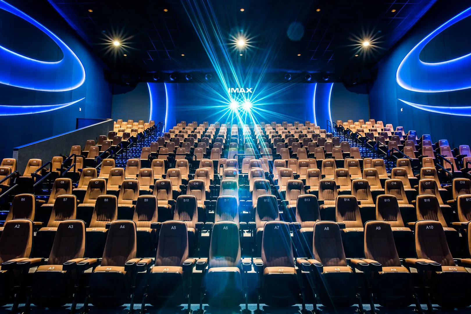 Modern IMAX movie theater in Miami featuring a giant screen, plush reclining seats, and immersive surround sound for a premium indoor cinema experience.